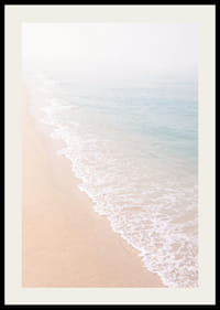 Gentle waves roll in towards the misty coast.-2