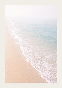 Gentle waves roll in towards the misty coast.-3