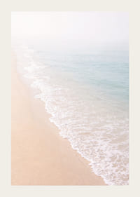 Gentle waves roll in towards the misty coast.-3