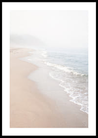 Soft morning mist sweeps over a quiet shoreline.-0