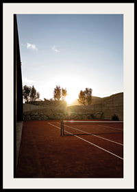 Quiet tennis court at sunset with warm stillness now-2