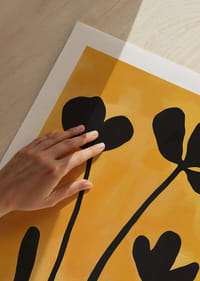Black silhouettes of flowers against a golden background.-9