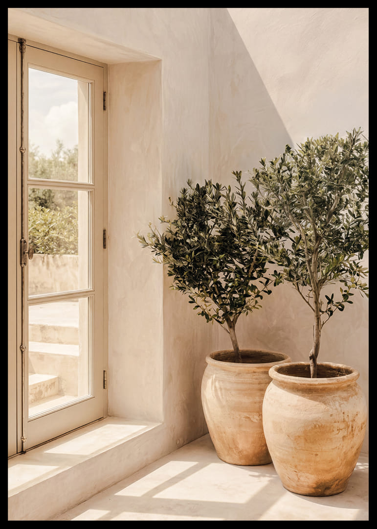 The sun's soft light dances over rustic pots and olive trees.-12