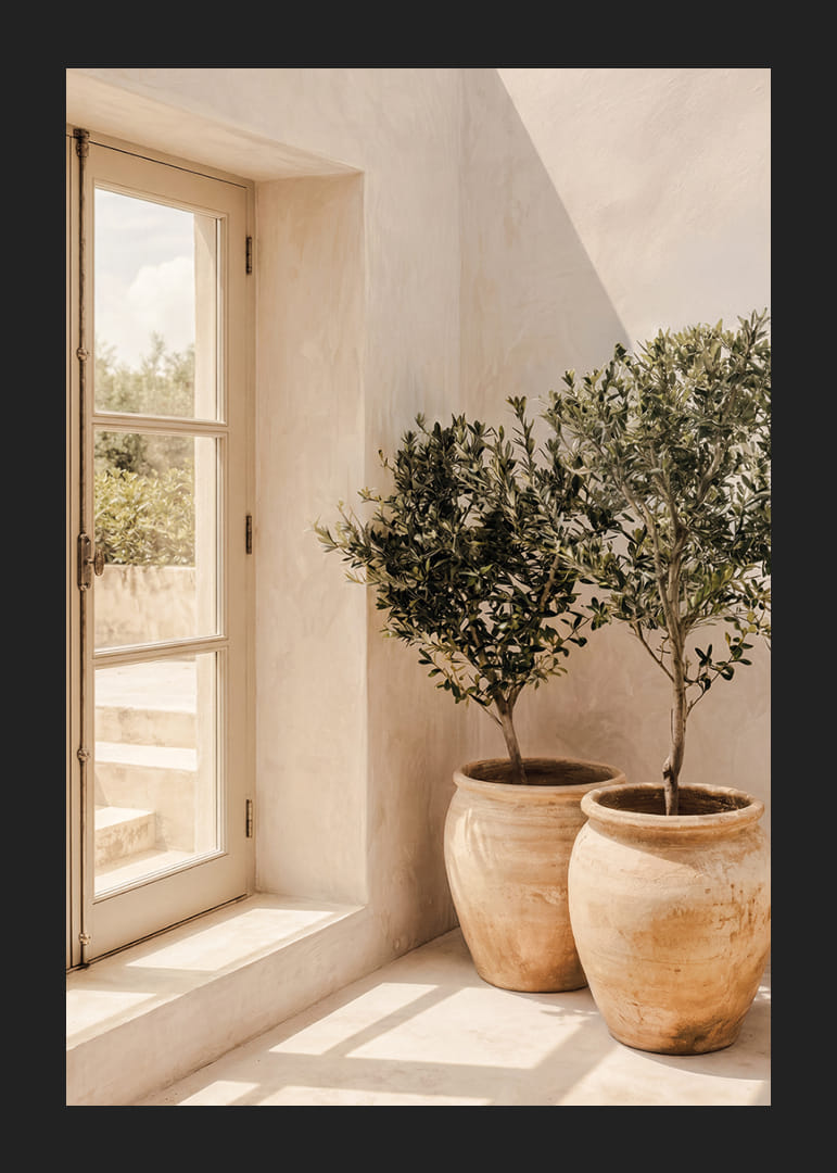 The sun's soft light dances over rustic pots and olive trees.-12