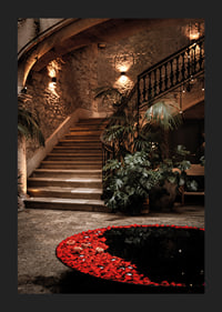 An illuminated staircase surrounded by roses and charm.-5