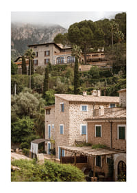 Charming village with stone houses surrounded by lush greenery.-1