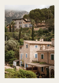 Charming village with stone houses surrounded by lush greenery.-3
