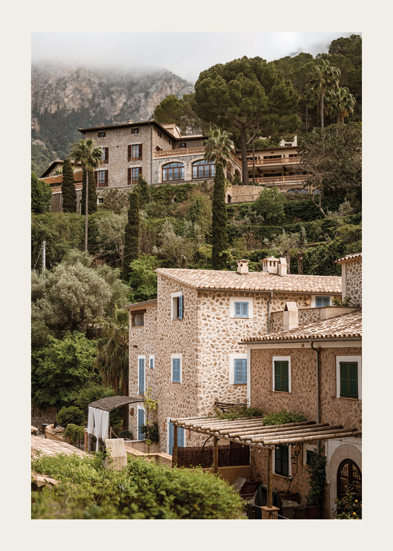 Charming village with stone houses surrounded by lush greenery.-12