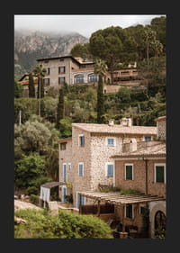 Charming village with stone houses surrounded by lush greenery.-5