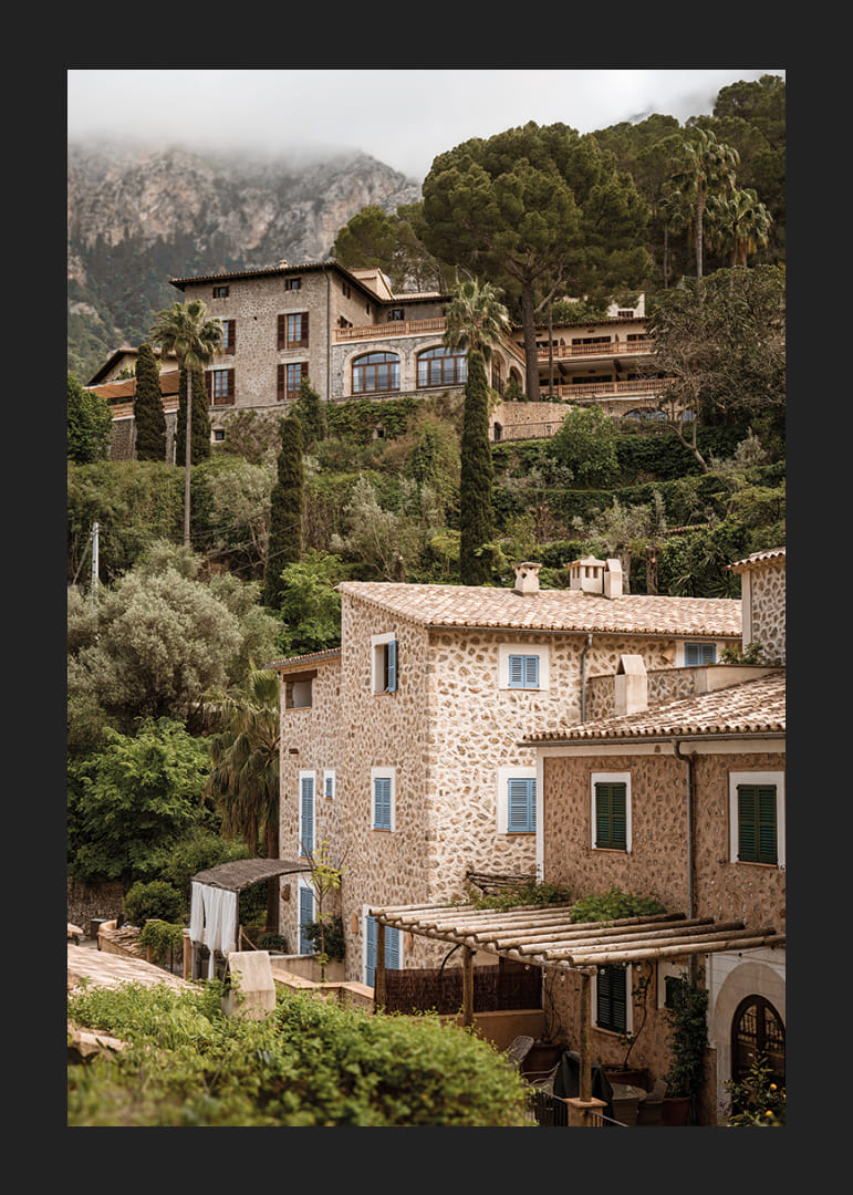 Charming village with stone houses surrounded by lush greenery.-12