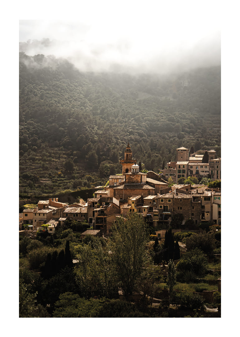 A village nestled in the silent embrace of the misty mountains.-12