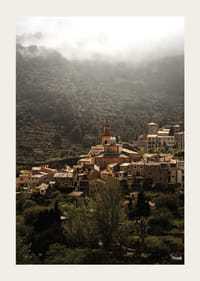 A village nestled in the silent embrace of the misty mountains.-3