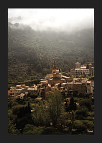 A village nestled in the silent embrace of the misty mountains.-5