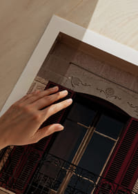 An elegant balcony with rustic red shutters.-9