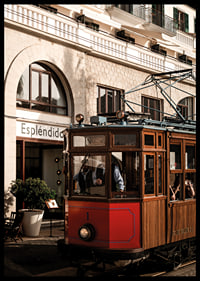 Charming tram in the golden glow of the evening sun.-6