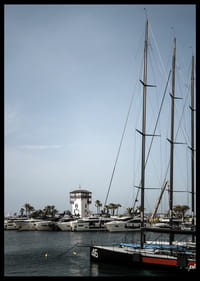 A quiet harbor with elegant masts against a clear sky.-6