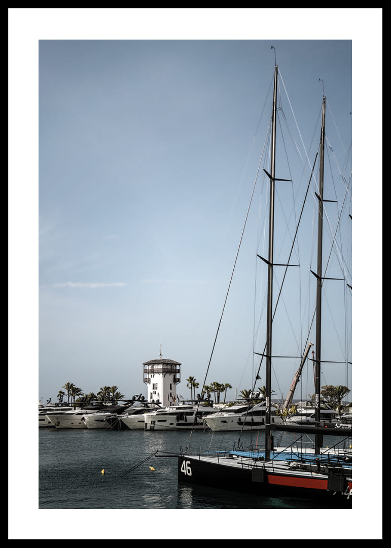 A quiet harbor with elegant masts against a clear sky.-12