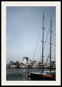 A quiet harbor with elegant masts against a clear sky.-2