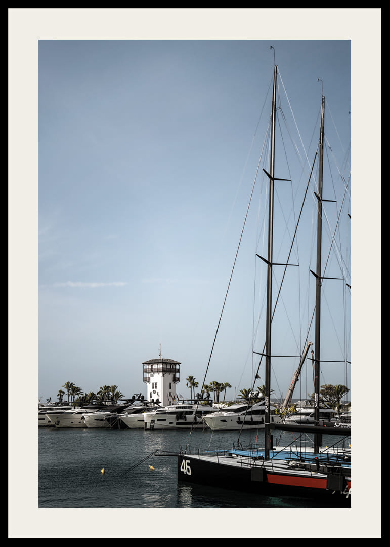A quiet harbor with elegant masts against a clear sky.-12