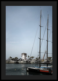 A quiet harbor with elegant masts against a clear sky.-4