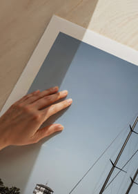 A quiet harbor with elegant masts against a clear sky.-9