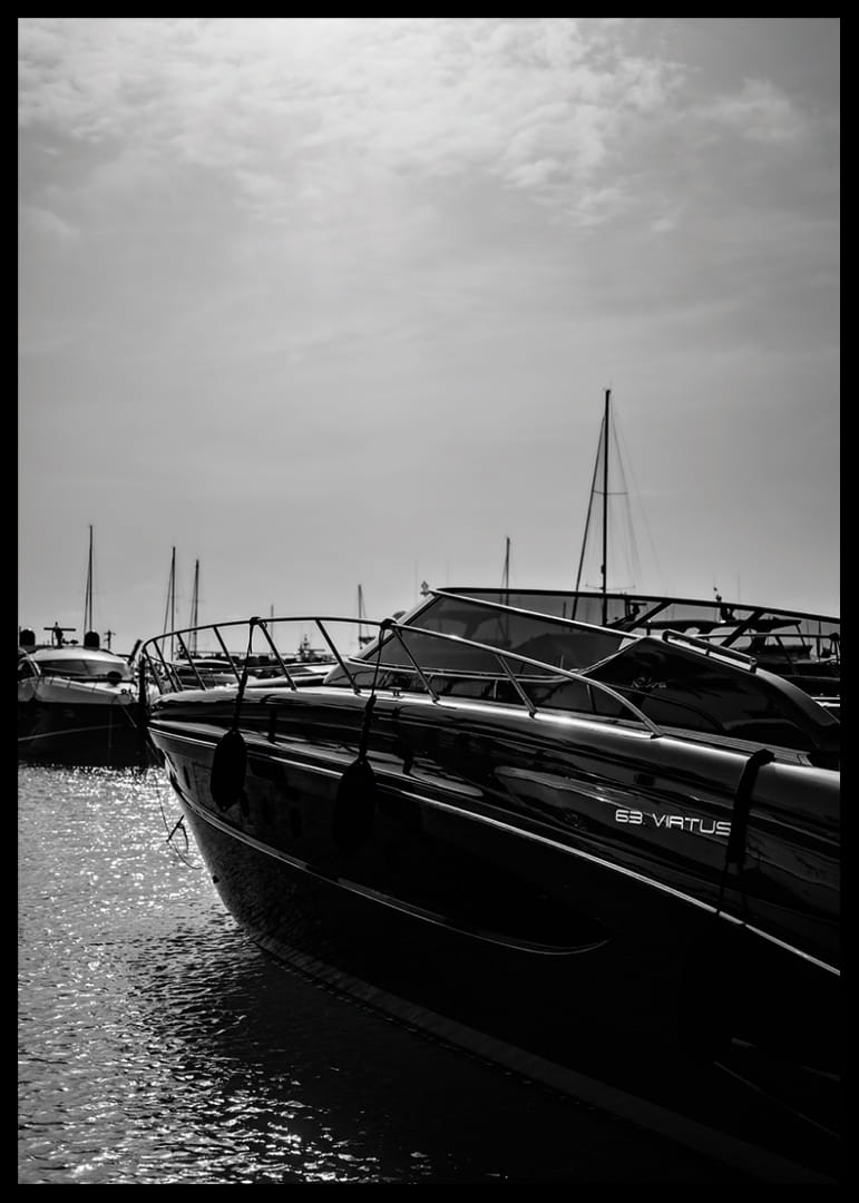 Silhouettes of boats in a calm water landscape.-12