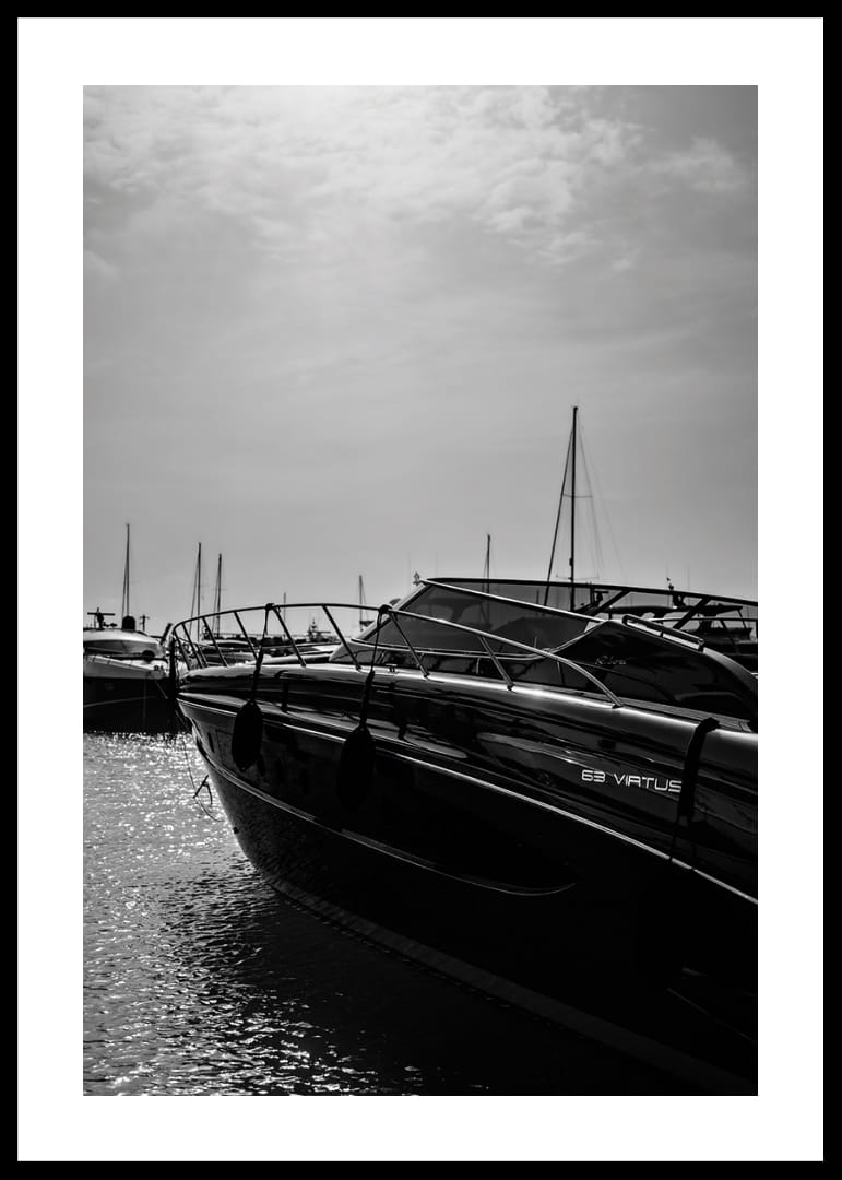Silhouettes of boats in a calm water landscape.-12