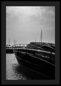 Silhouettes of boats in a calm water landscape.-4