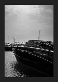 Silhouettes of boats in a calm water landscape.-5