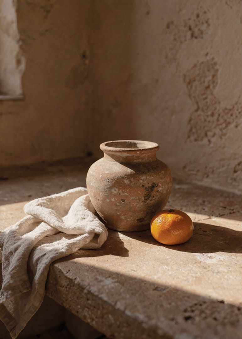 Rustic ceramics and citrus create a timeless atmosphere.-12