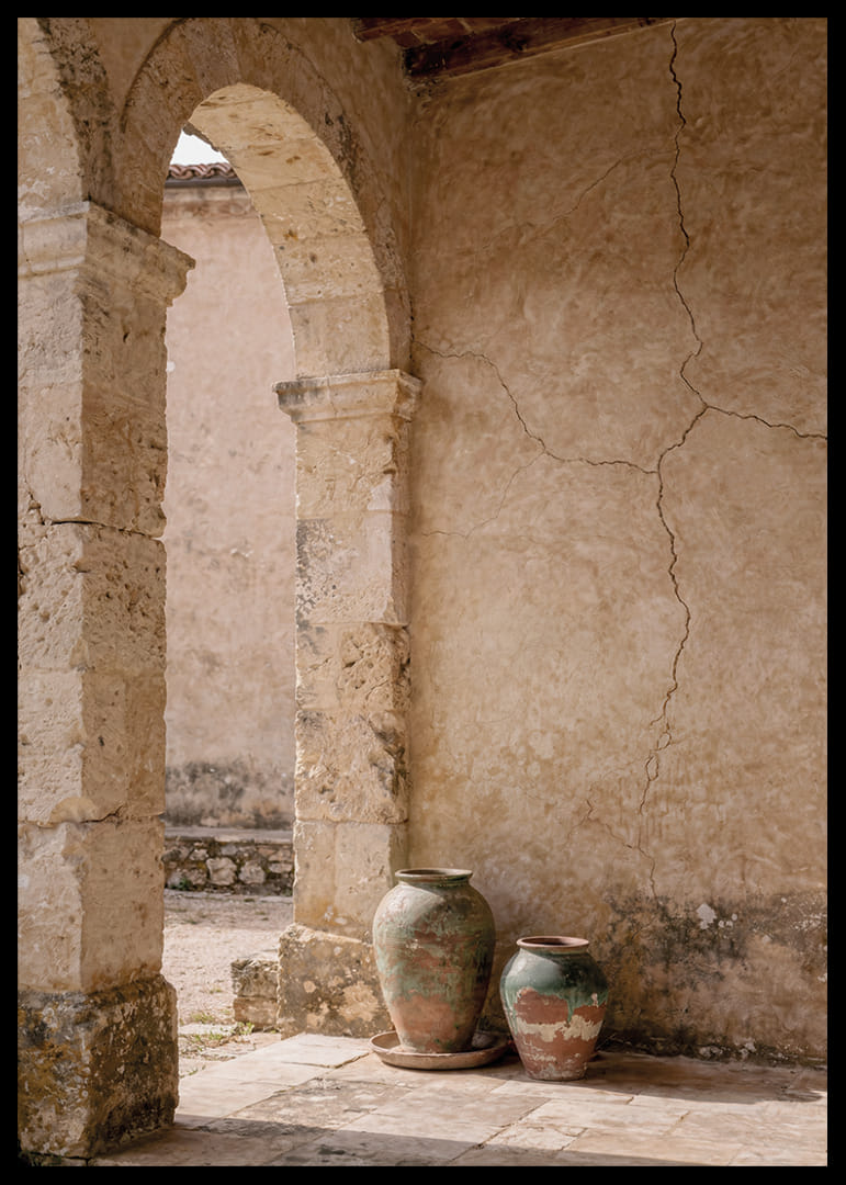 Two rustic pots rest under a timeless stone arch.-12