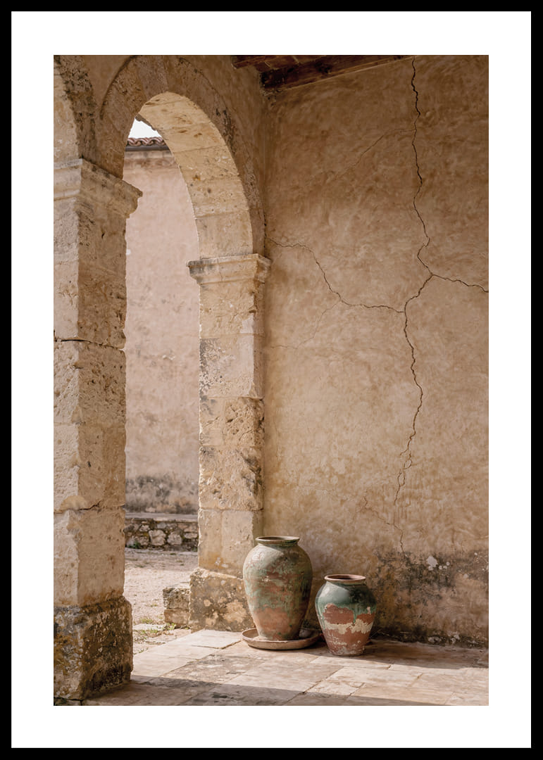 Two rustic pots rest under a timeless stone arch.-12