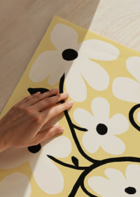 Playful white flowers on a light yellow background spread joy.-3