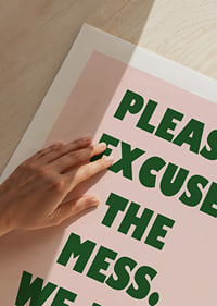Typographic poster with a humorous message in dark green against light pink.-9