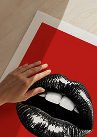 Glossy black lips against a red base create a bold and glamorous feel.-9