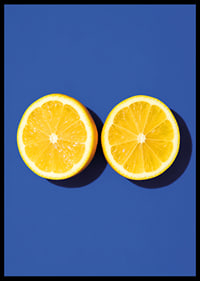 Two sunny yellow lemon halves shine against a deep blue background with fresh energy.-6