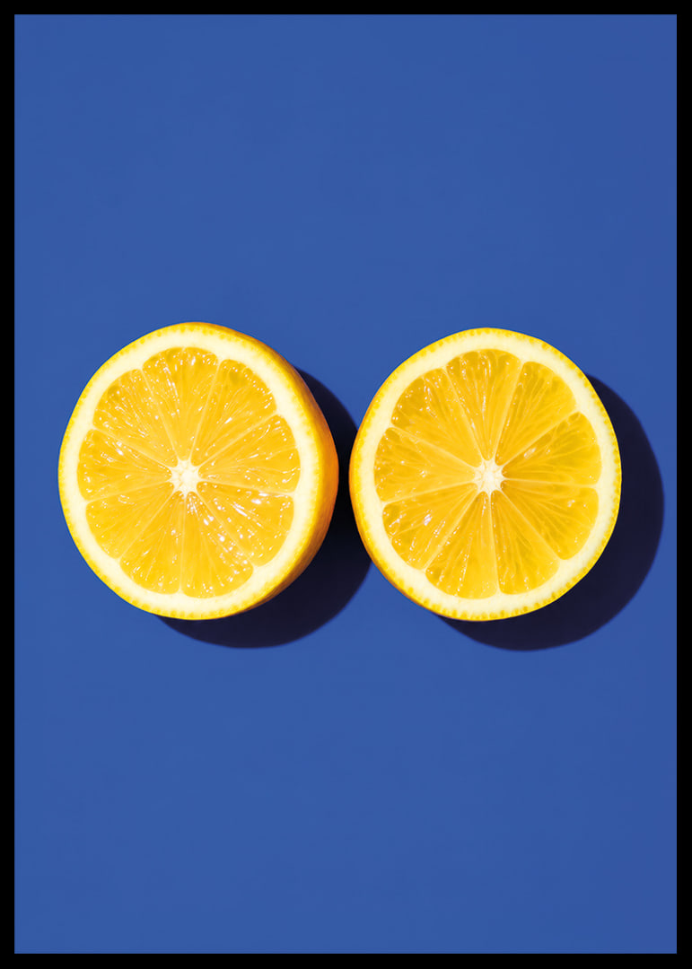 Two sunny yellow lemon halves shine against a deep blue background with fresh energy.-12