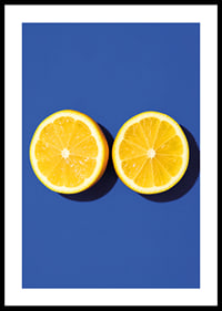 Two sunny yellow lemon halves shine against a deep blue background with fresh energy.-0