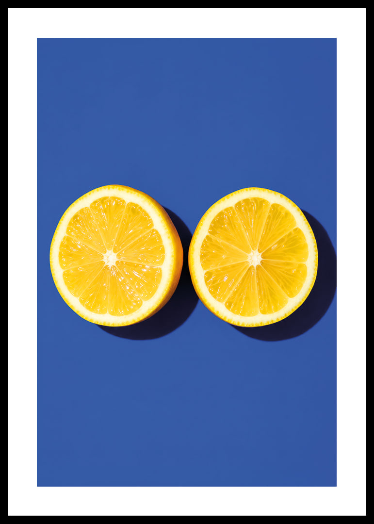 Two sunny yellow lemon halves shine against a deep blue background with fresh energy.-12