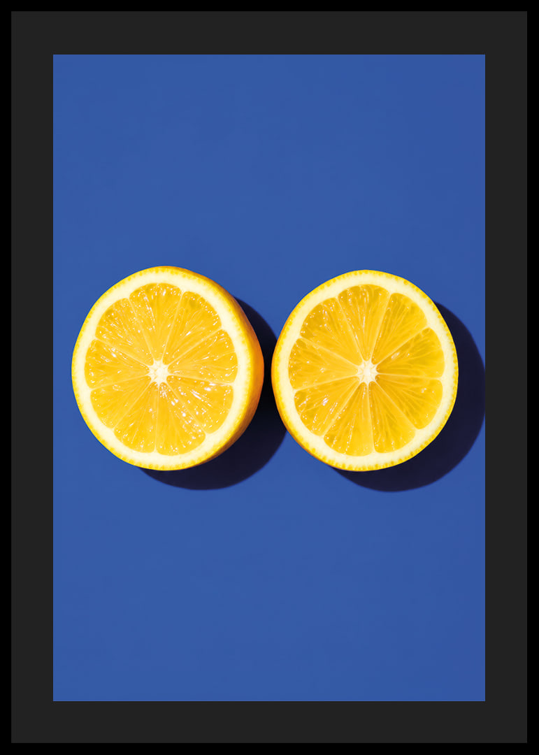 Two sunny yellow lemon halves shine against a deep blue background with fresh energy.-12
