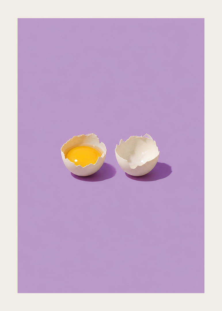 A golden egg in cracked shell against a purple background with a playful, stylish feel.-12