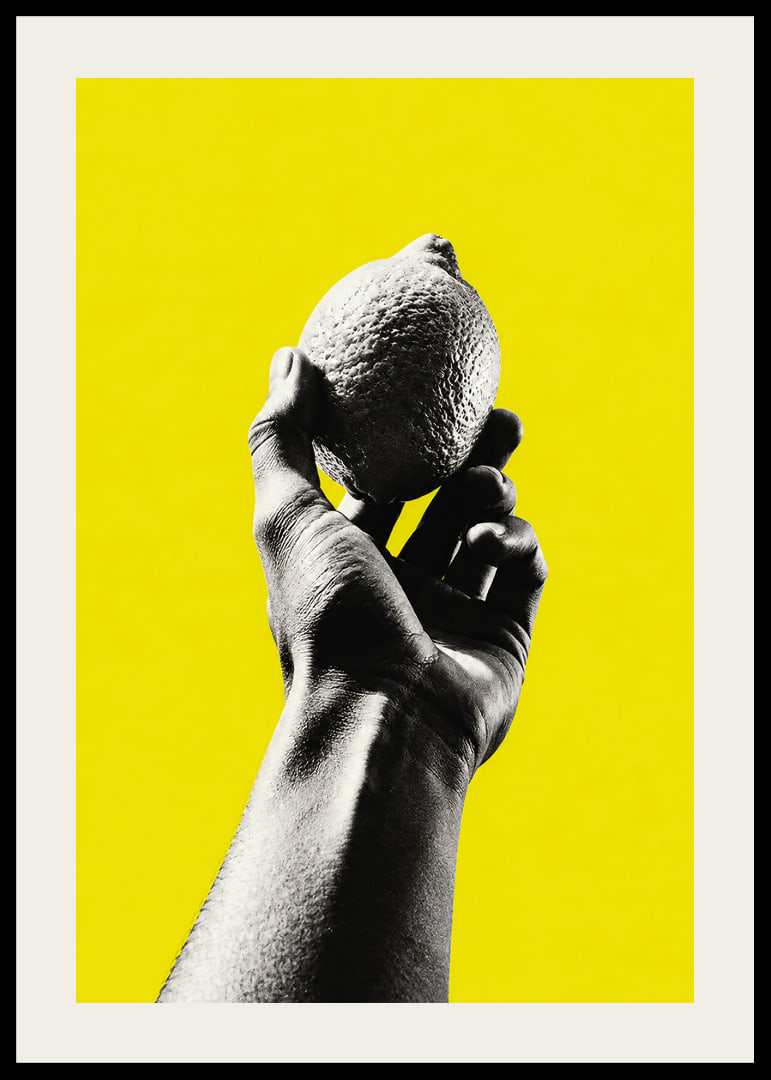A hand lifts a lemon against an intensely yellow background with graphic energy.-12