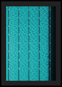 Turquoise pool water and dark track lines create a cool, graphic rhythm.-4