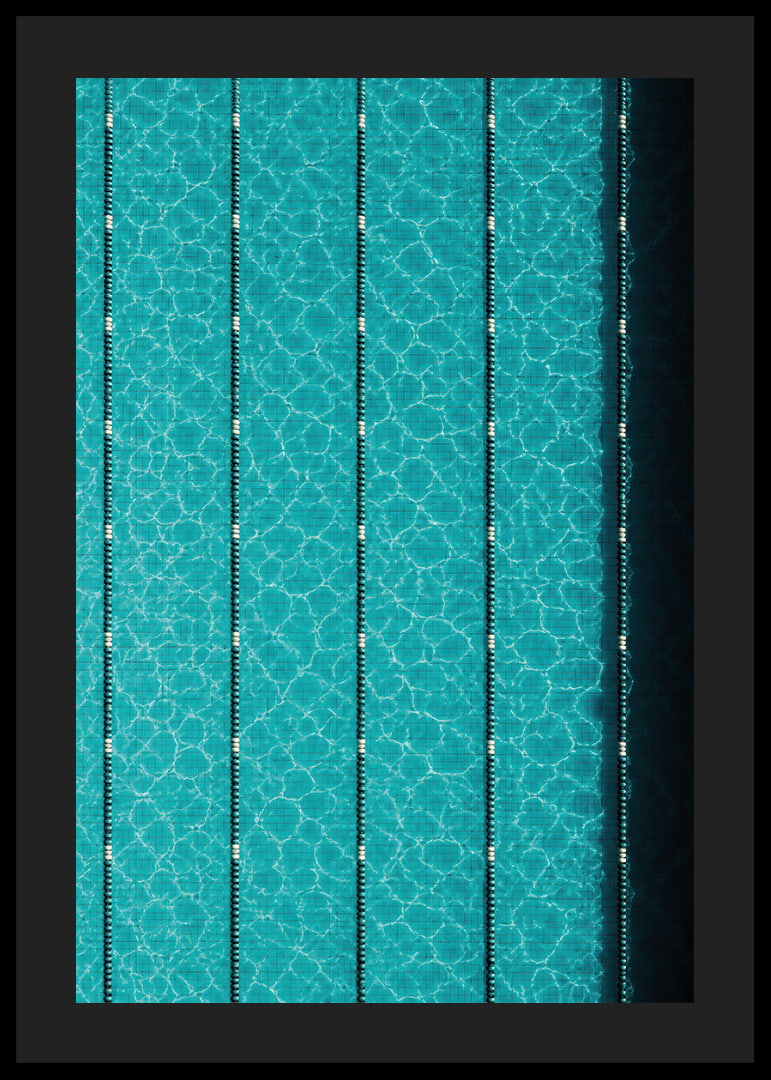 Turquoise pool water and dark track lines create a cool, graphic rhythm.-12