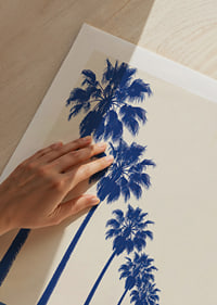 Blue-toned palm trees along a coastal road create a calm, sunny retro feel.-9