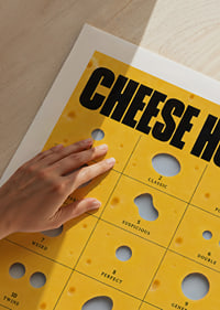 Humorous guide to cheese holes in golden yellow with bold typography.-9