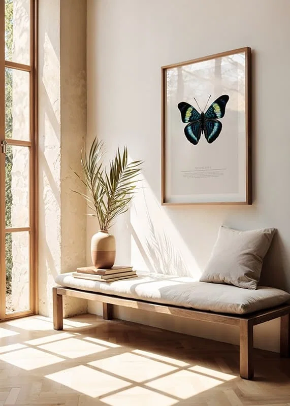 Illustrated butterfly with blue, turquoise and yellow wings against a white background-12