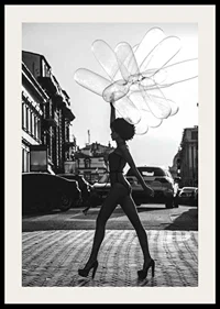 Black and white silhouette of woman with balloons in urban environment-2