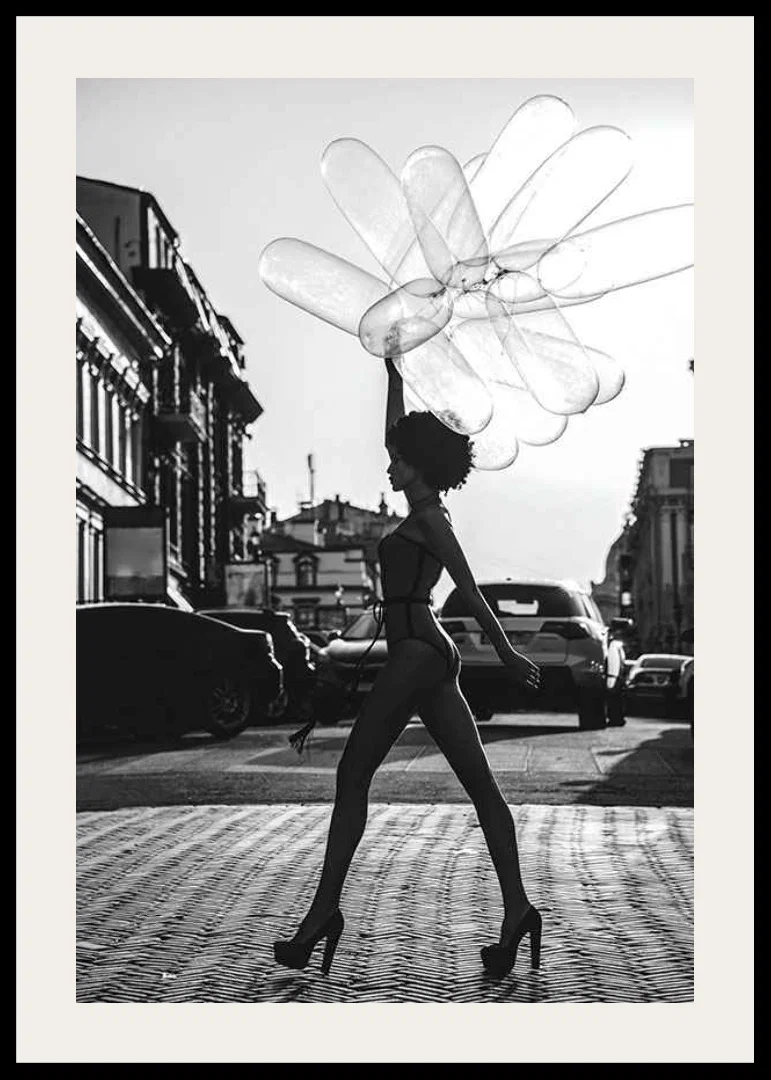 Black and white silhouette of woman with balloons in urban environment-12