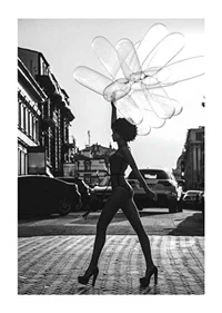 Black and white silhouette of woman with balloons in urban environment-1